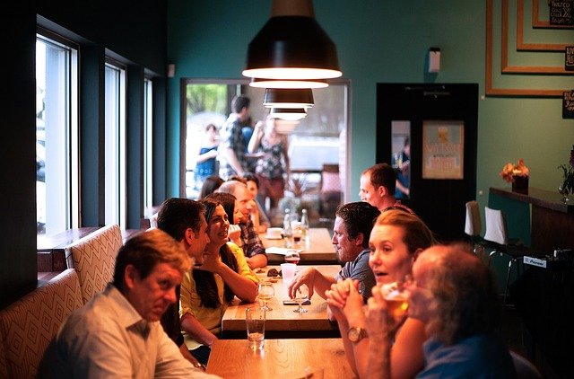 people discussing around a table at the restaurant